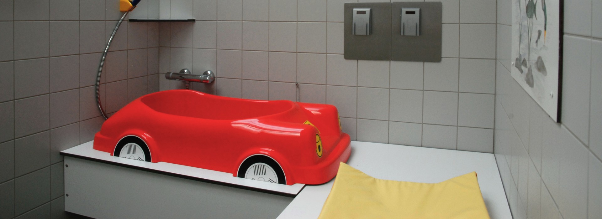 Kinderbadje auto 1ste gebouw